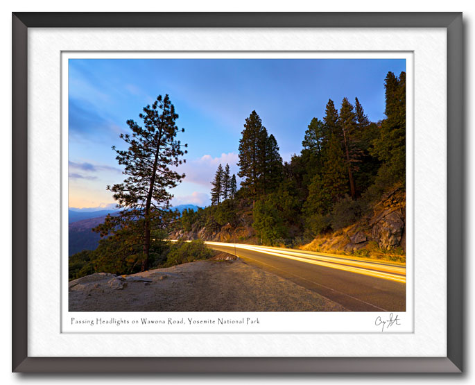 Headlights of passing cars on Wawona Road in Yosemite National Park