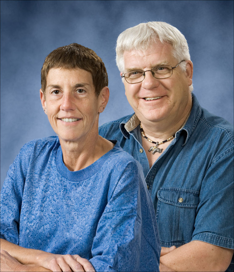 Each person was photographed individually and then combined using Photoshop.  This allows you to choose the best expression for each person, and you don't even all have to be present at the same time.