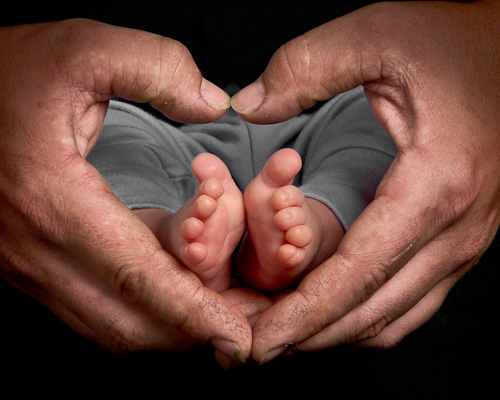 Hands and baby's feet